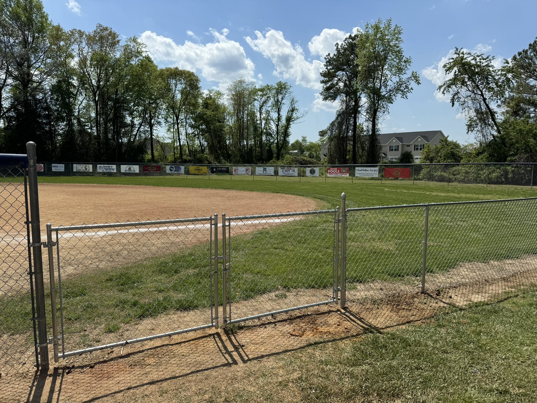 Galvanized chain link backstop at a Delaware ballfield