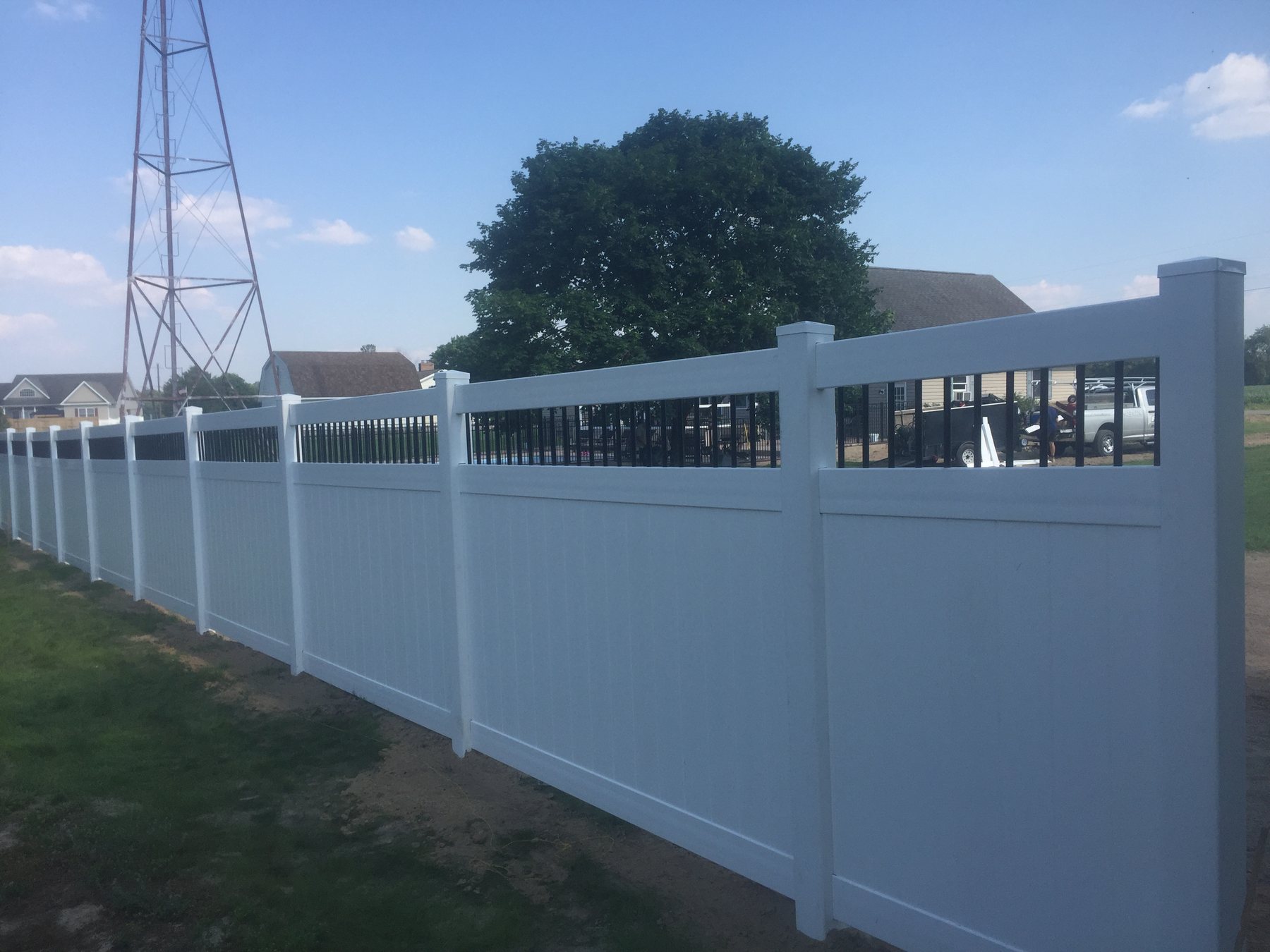 White vinyl privacy fence with a lattice top accent